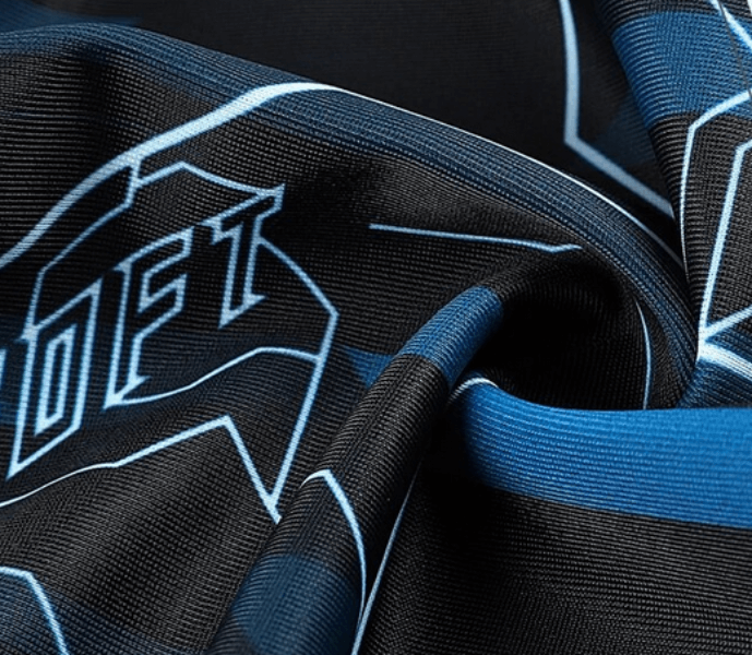 Close-up of black and blue printed fabric, showcasing soft texture and breathable design of men's polyester beanie.